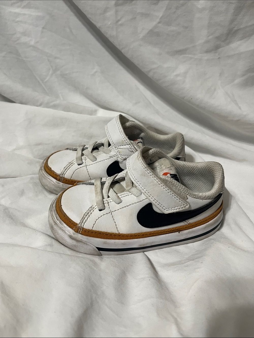 Nike Court Legacy Kids White Sneakers with Black Swoosh and Tan Accent